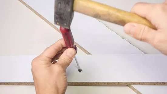Tap The Screwdriver With A Hammer